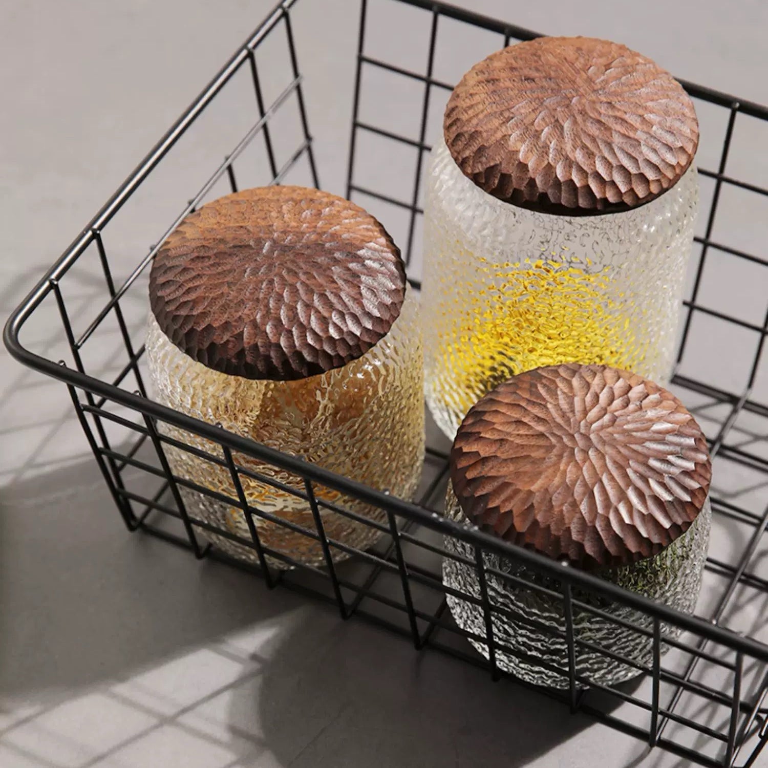 Close-up of Haven Black Walnut Hammered Seal Glass Container