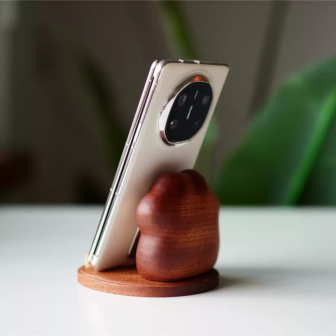 Cute Cat-paw Solid Wood Phone Stand holding smartphone