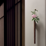 Flora black walnut wall vase hanging on living room wall