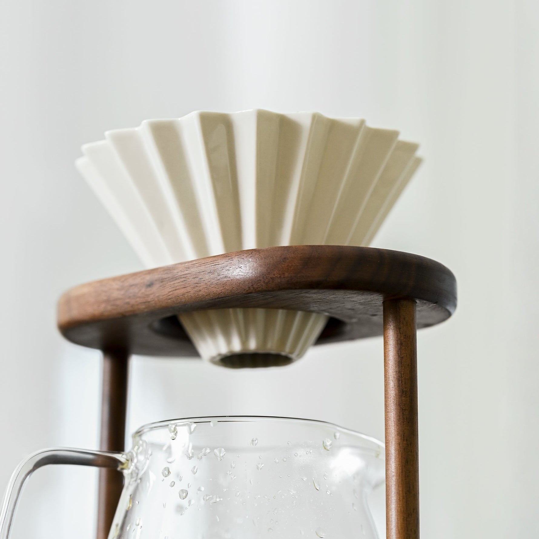 Minimalist walnut pour-over coffee stand on countertop