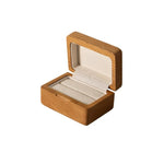 Natural solid wood ring box shown on a white background