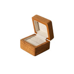 Ring presented inside natural solid wood box