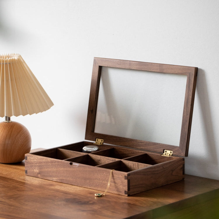 Top-down view of jewelry compartments inside wooden box