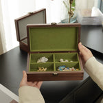 Walnut jewelry box with subtle Emerald branding